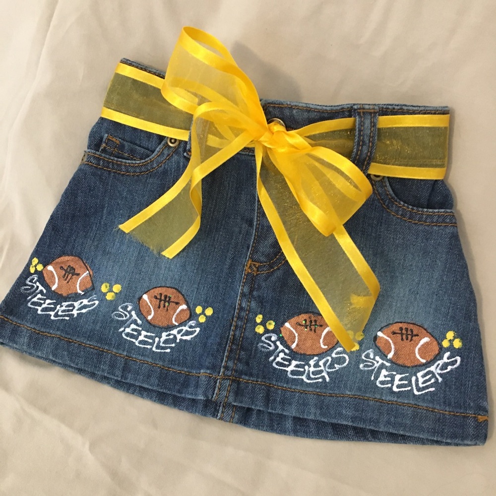 Girls 12 mo. jean skirt with Steelers decoration.